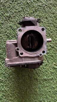 Škrtící klapka 1,8t AGU - 2