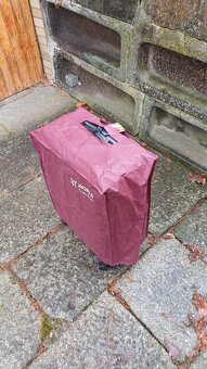 Prodám nový ochranný obal na kufr,vel.26 - 2