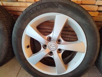 Kompletní originál letní kola Mazda3 - 2