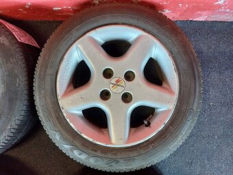 ALU disky 4x100 R15 7Jx15H2 ET 38 s letními pneu 185/65 R15 - 2