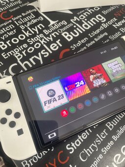 Nintendo Switch OLED + hry + Pro Controller + obal - 2