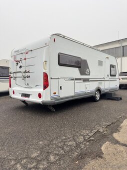 Knaus Royale 580 ~ Extra velká postel - 2