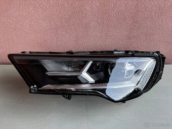 Audi q7 levý světlomet - 2