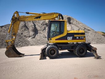 Kolové rypadlo CAT M315 - 2