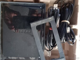 modém zn.Netgeear DGNT 1000B. - symbol.cena - 2