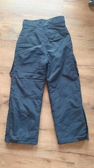 Vyleteplené kalhoty Okay vel.128. - 2