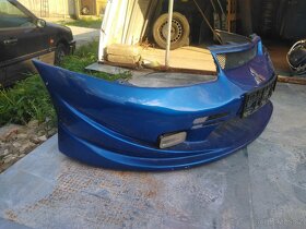 Tuningový laminátový nárazník Mitsubishi Carisma 1995-1999 - 2