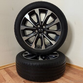 MAZDA CX-3 5x114,3 R18 ET50+LETNÍ 215/50R18 6,5mm - 2