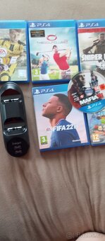 Nabíjecí na ps4stanice + kabel a 7 her na ps4 - 2