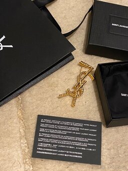 Saint Laurent Cassandre brož - 2