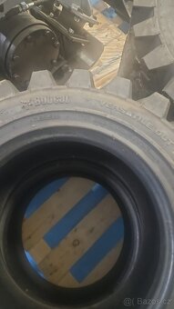 Pneu Bobcat originál 10x16,5 - 2