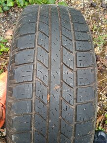 Opel Frontera a jiné pneu Wrangler na rezervu 215/65R16 - 2