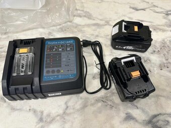 (543) Nabíječka + 2× baterie 18V 8. - 2