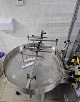 Plnicí linka s automatickým uzavíráním. Hmotnostní průtokomě - 2