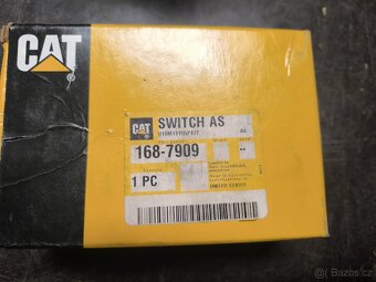 Sestava magnetického spínače Cat® (12 V)
- 2