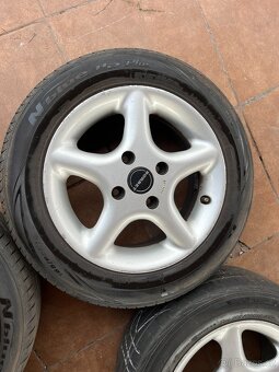 4x alu disky 4x108 R14, letní pneu - 2