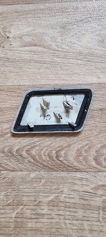 Krytka ostřikovače světel. - 2