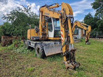 Kolové rypadlo LIEBHERR 312 kolový bagr LIEBHERR A312 - 2