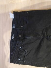 Černé dětské jeans a tričko Puma vel. 158 - 2