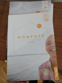 Učebnice NJ A2.1 Momente - 2