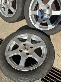 Alu kola+nexen Daewo Nubira 2004 -4x114,3 mm. 56,6 mm. - 2