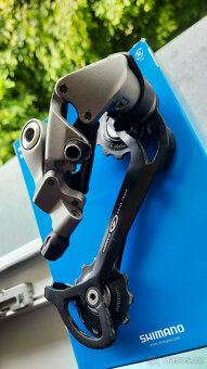 Přehazovačka Shimano RD-M571, 9s - 2