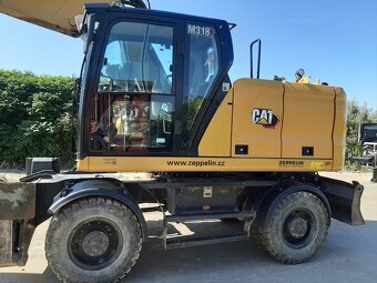 Kolový otočný bagr CAT M318 - 2