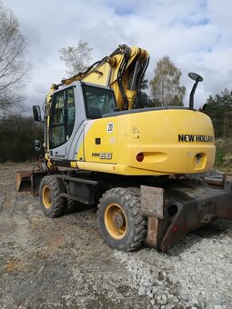 Prodám kolový bagr New Holland MH 5.6, 20,5 t, r.v. 2009, 8. - 2
