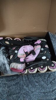 Dívčí brusle vel. 31-34 růžové, cena 100 Kč - 2