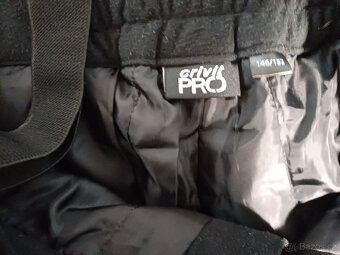 Černé oteplovačky zn. Crivit vel. 134/140 - 2