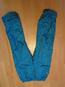 zateplené šusťákové kalhoty zn. T&GO - vel. 134, modré - 2