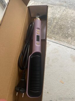 Nová žehlička na vlasy . - 2