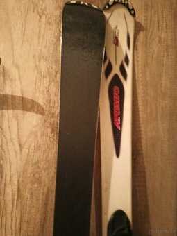 lyže Atomic,+dětské lyž.helmy+lyž.kalhoty L+lyžáky23 a 26 - 2