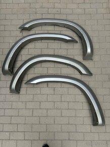 Nissan Patrol Y61 Plastové lemy , zadní nárazník , výztuha - 2