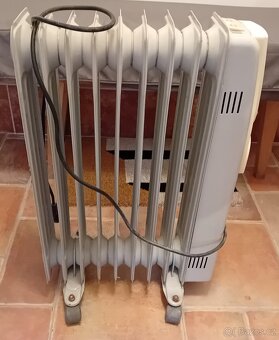 Elektrický olejový radiátor na kolečkách RAVANSON 2000W - 2