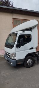 Větrný štít , kšilt , spojler na kabinu. - 2