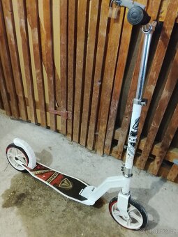 Dětská koloběžka. - 2