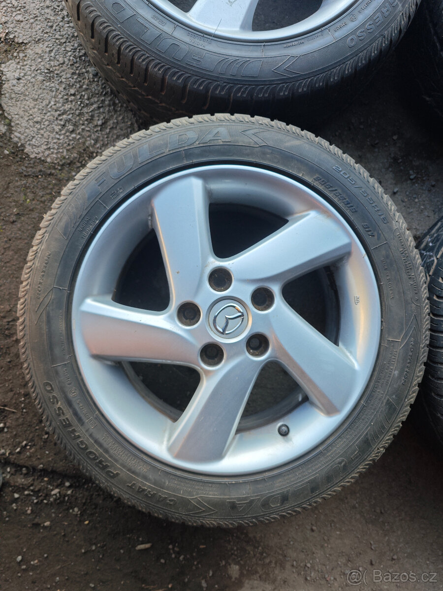 Prodám sadu Alu disků Mazda 7Jx16H2 ET55 + pneu 205/55/16 - 3