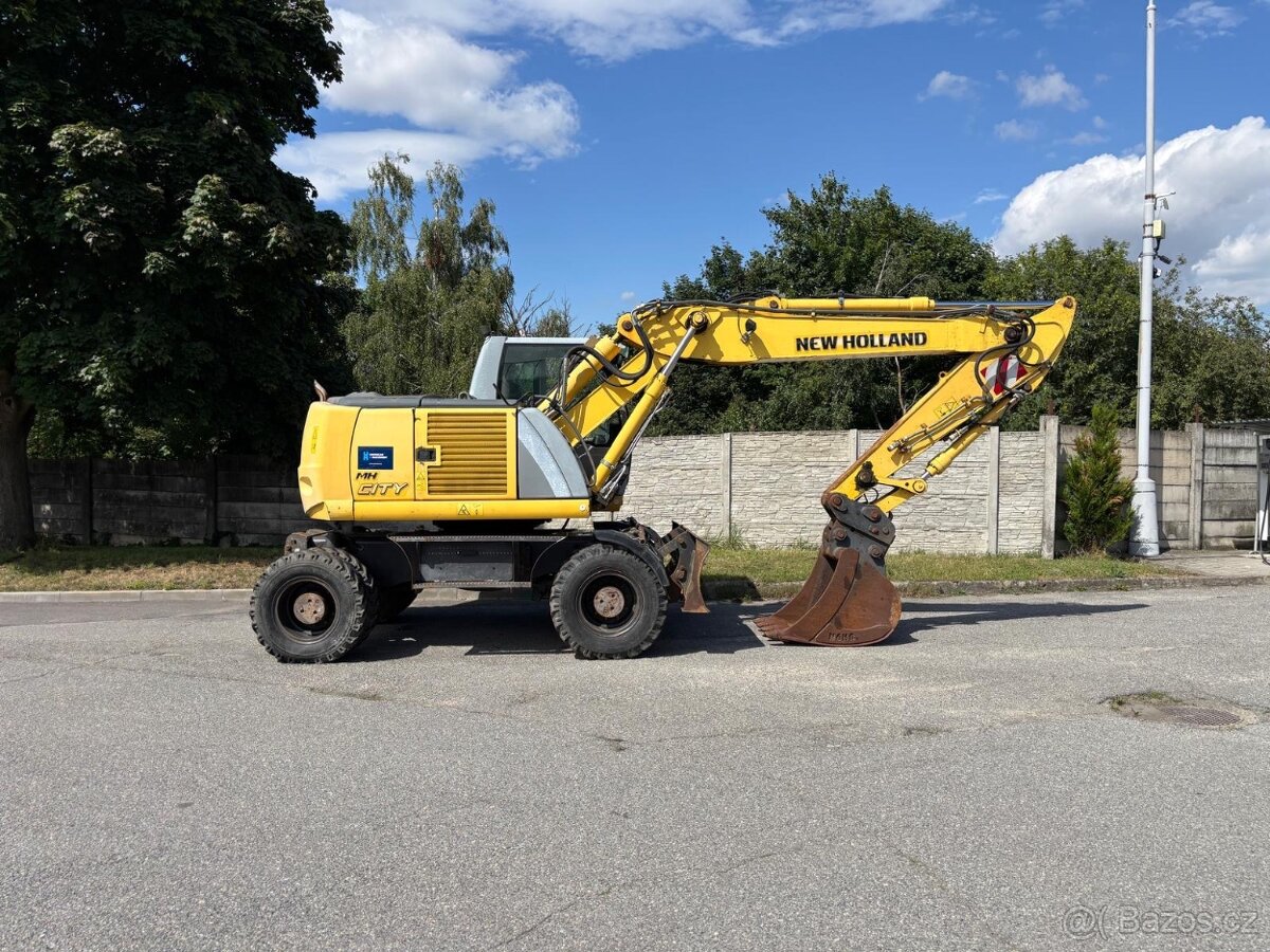 Kolové rypadlo / nakladač New Holland MH CITY - 3