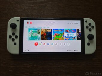 NINTENDO SWITCH OLED (bílá verze) + 4 HRY A CESTOVNÍ OBAL - 3