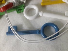Klip / držák na namotání / zkrácení sluchátek - 3