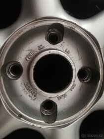 prodám zánovní pneu i s disky z mits.colt 1,3 70 kw,z30 2004 - 3