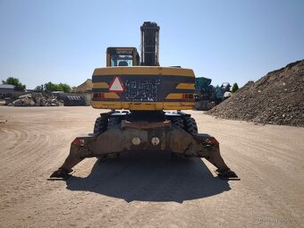 Kolové rypadlo CAT M315 - 3