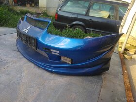 Tuningový laminátový nárazník Mitsubishi Carisma 1995-1999 - 3