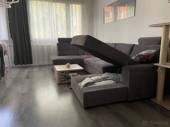 Šedá rozkládací sedačka s úložným prostorem - 3