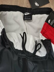 Nové šusťákové kalhoty s podšívkou Nike vel. L - 3
