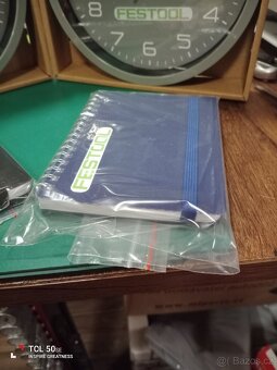 Hodiny, nástěnné 20 cm. ,,Festool"+linkovaný A6 zápisník. - 3