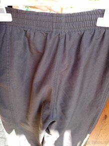 Kalhoty šusťakové v. 150/152 - 3