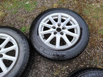 Prodám ALU kola rozteč 5x100 R15 ET 35 s letním pneu 195/65 - 3