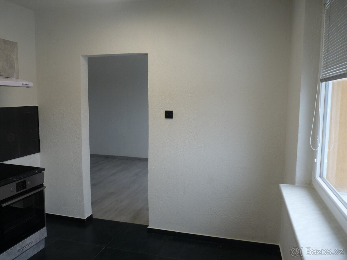 Pronájem kompletně zrekonstruovaného bytu 2+1 Spartakiádní 1 - 4